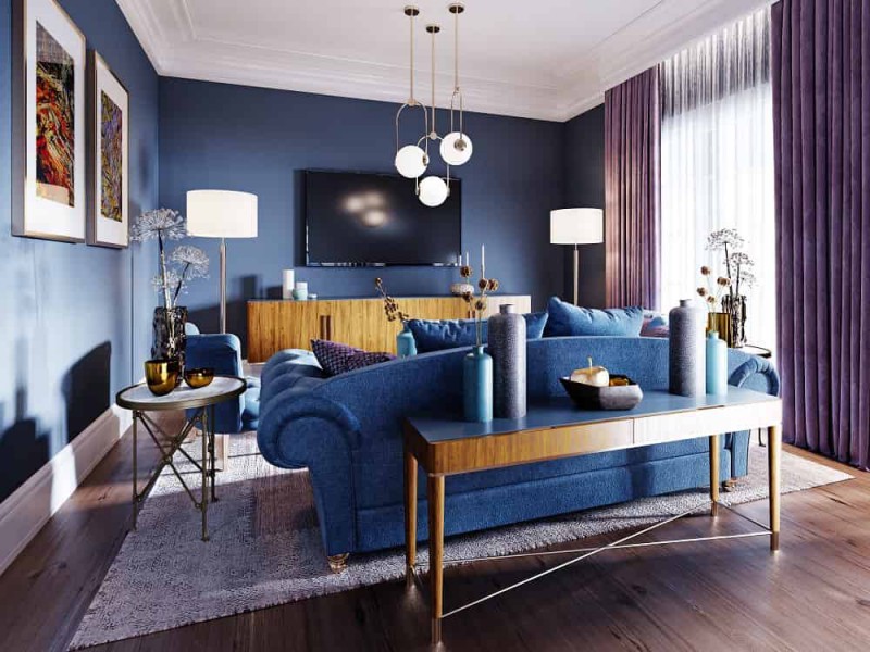 styl art deco w salonie z niebieskimi welurowymi meblami 